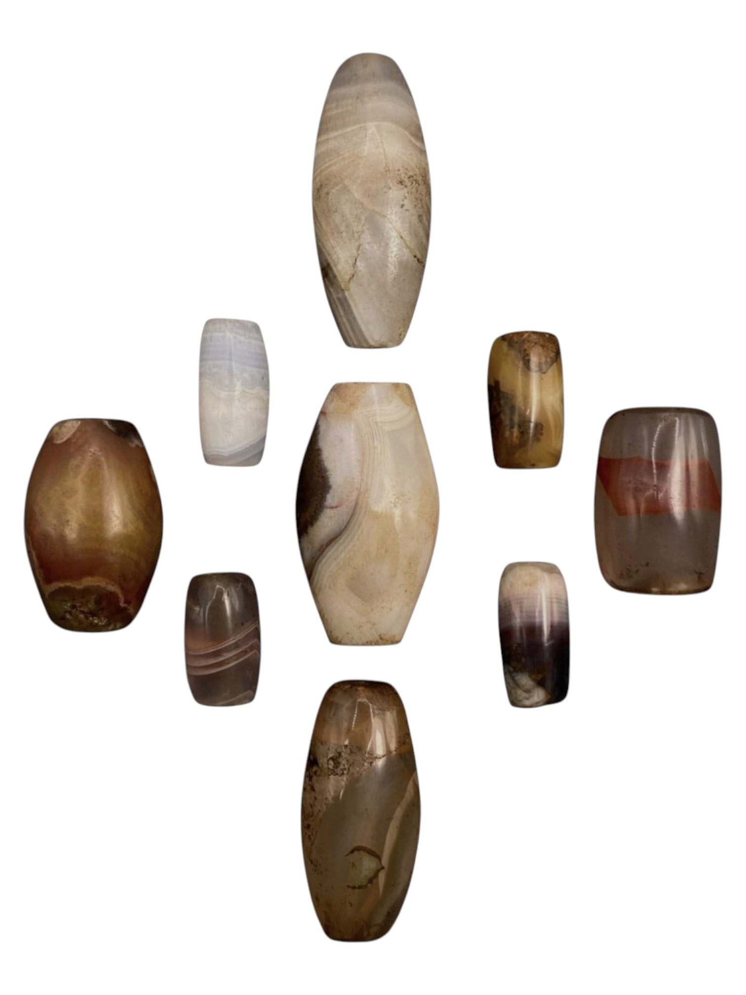 Lot of 9 Himalayan Banded Agate Beads, Ancient to Antique Period, 33WT: A group of nine beads crafted from banded agate, showcasing natural tones including translucent white, grey, amber, reddish-brown, and multi-tonal hues, with characteristic concentric, wavy, and linea