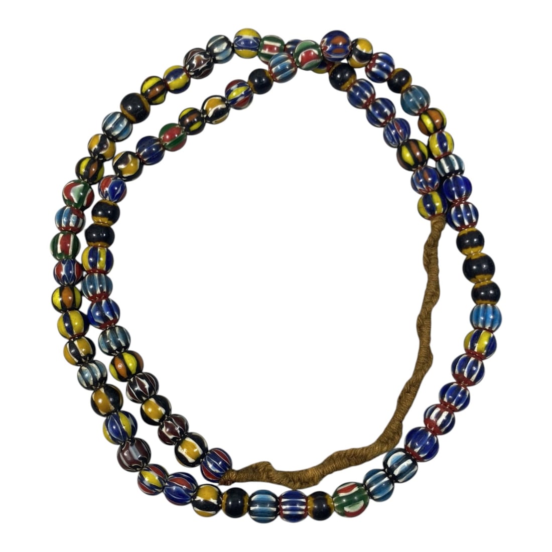 Strand of Antique Chevron Glass Beads, Unstrung, 52AH: A single strand of unstrung antique chevron glass beads, measuring approximately 30 cm in length. The strand features round beads adorned with vibrant, multicolored striped chevron patterns, character