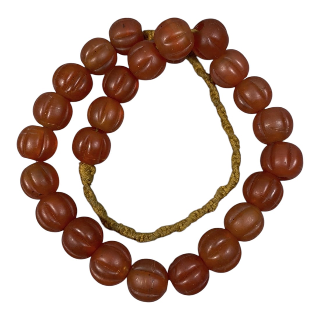Strand of Vintage Chinese Glass Melon Beads, Unstrung, 48AH: A single strand of unstrung vintage Chinese glass melon beads, measuring approximately 23 cm in length. The strand features uniformly sized, round beads carved into a classic "melon" or "pumpkin" shap