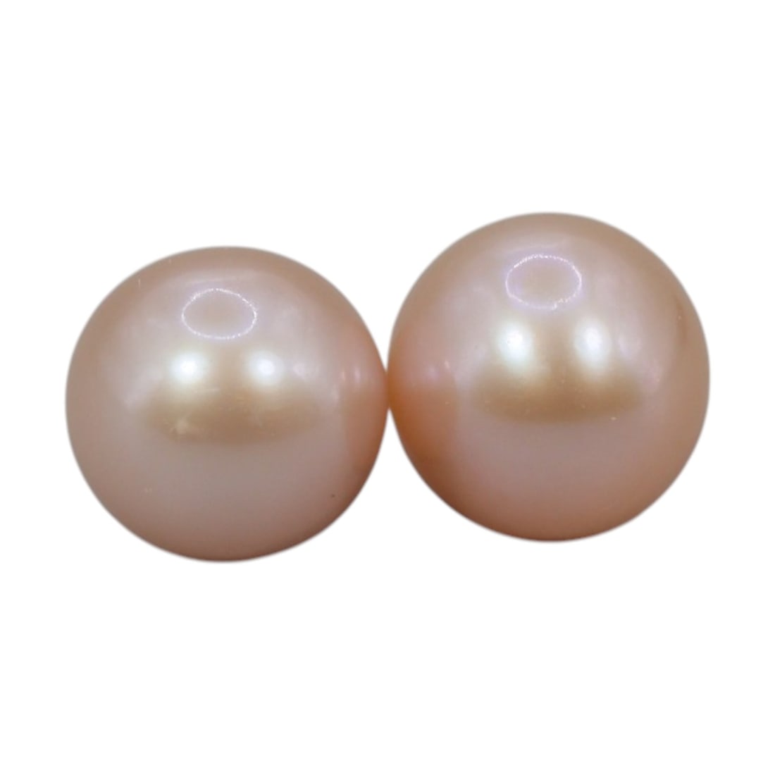 Freshwater Pearl Pair - Natural Pearl Peach Round Gemstones 8mm, 44XA: A matched pair of natural freshwater pearls, exhibiting a soft peach-pink hue with bright, uniform luster and subtle iridescent orient. The pearls are near-spherical, with smooth nacre and only minor 