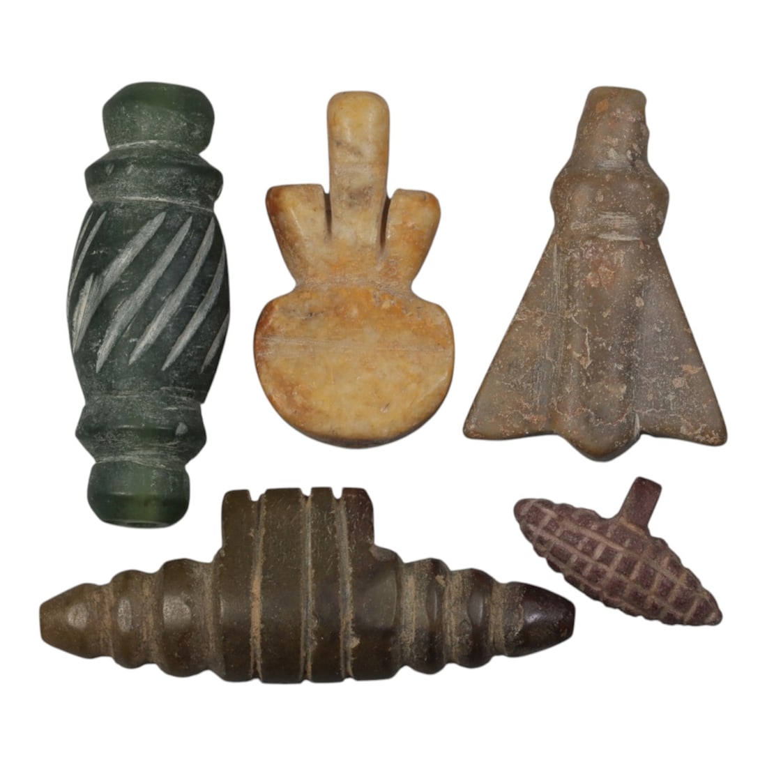 Lot of 5 Ancient Coptic Egyptian Stone Amulets, Circa Roman to Coptic Era, 96WP: Carved from various stones, including green, tan, brown, and reddish varieties, the group consists of five amulets of distinct forms. The set includes a spirally incised barrel bead, a double-plumed s