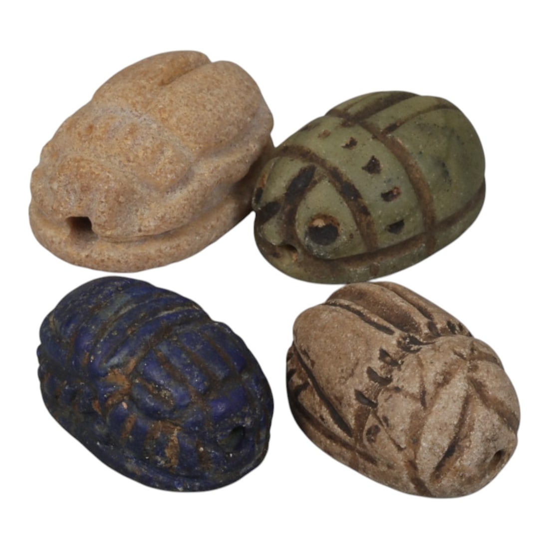 Lot of 4 Ancient Coptic Egyptian Multi-Stone Scarabs, Circa Roman to Coptic Era, 92WT: Carved from various materials including light stone, green stone, lapis lazuli, and earth-toned stone, the group consists of four distinct scarab amulets. Each piece features the characteristic scarab