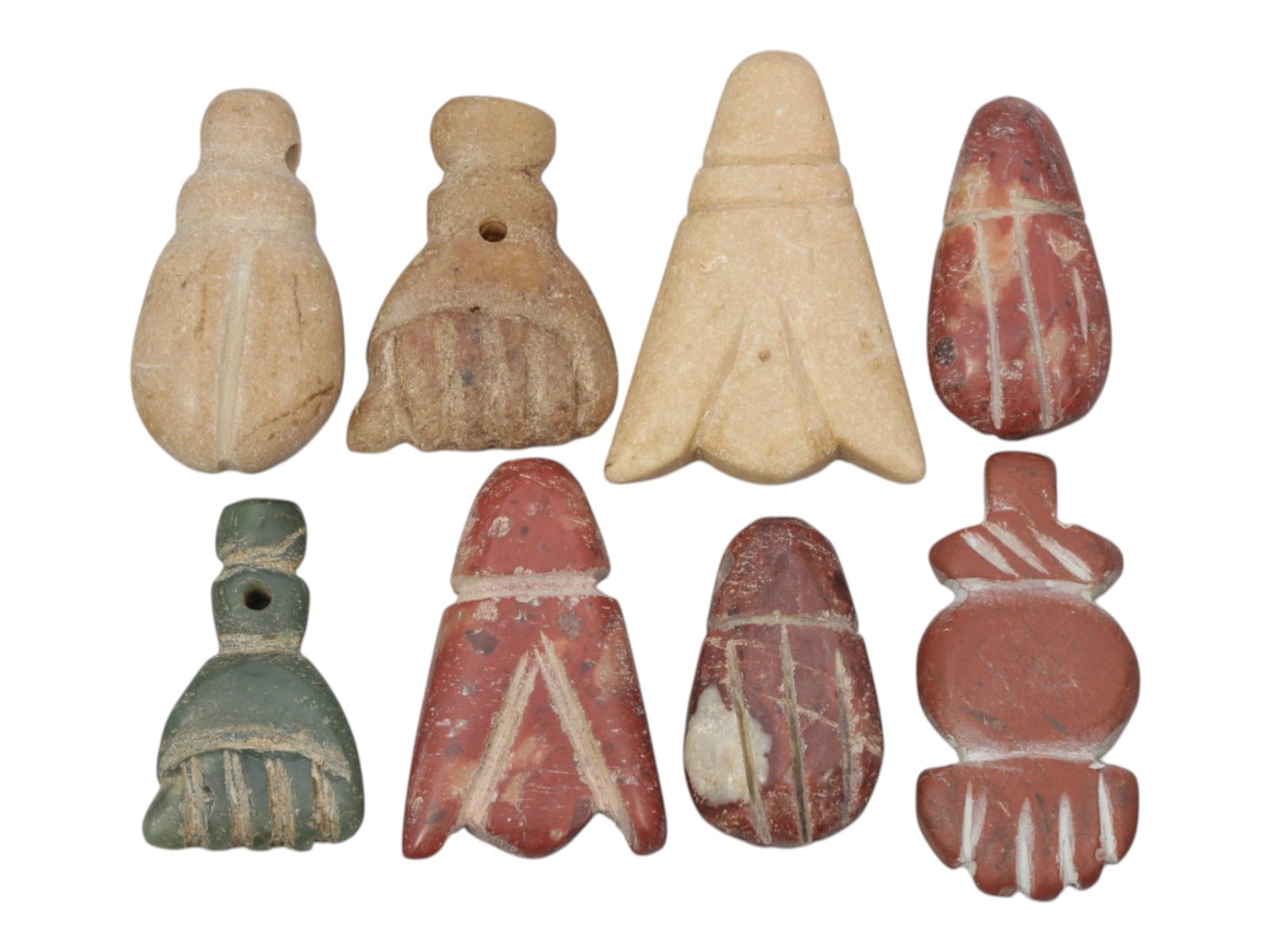 Lot of 8 Ancient Coptic Egyptian Multi-Stone Amulets, Circa Roman to Coptic Era, 67WT: Carved from various earth-toned stones including beige, red, and green varieties, the group consists of eight distinct amulets, ranging in size from 2 cm to 3 cm (0.79-1.18 in.). The set features styl