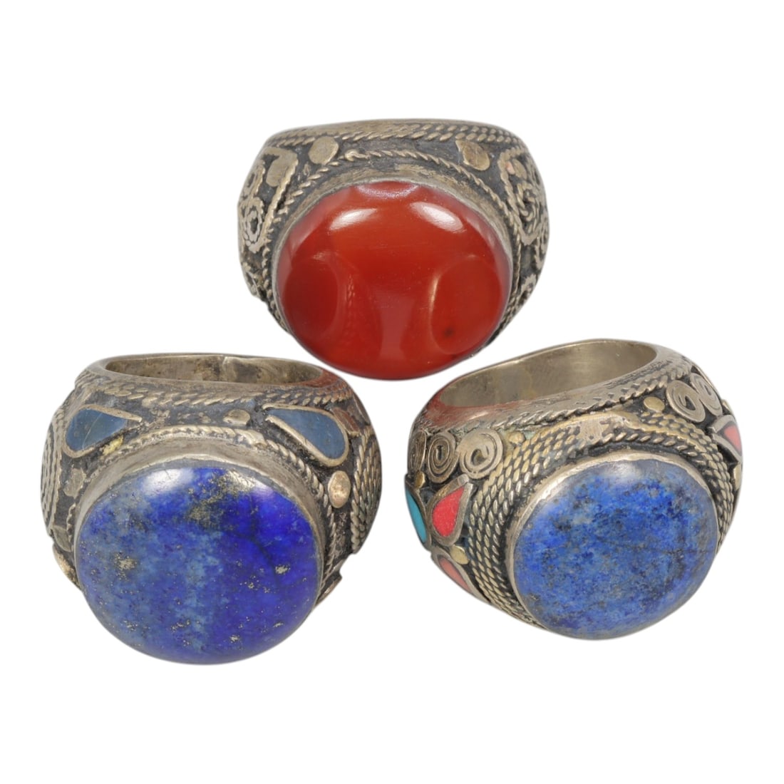 Lot of 3 Vintage Central Asian Tribal Silver Gemstone Rings, 42AD: A collection of three vintage tribal-style rings, characteristic of Central Asian folk jewelry traditions. Each ring is crafted from silver-toned metal with an aged patina, showcasing traditional twis