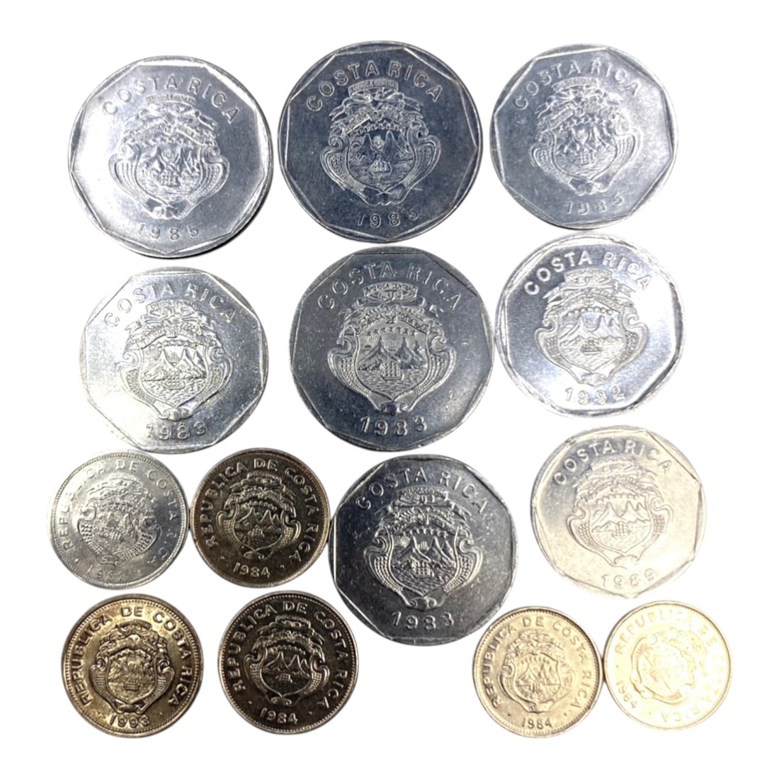 COSTA RICA: Peace & Democratic Continuity - 14-Piece Colon Coins Set, 1963-1993, 20-30mm, 55ZJ: This comprehensive 14-Piece Coins Set of Costa Rican Colon coins, minted between 1963 and 1993, spans three decades of the nation's commitment to democratic stability and pacifism. Ranging from 20 to 