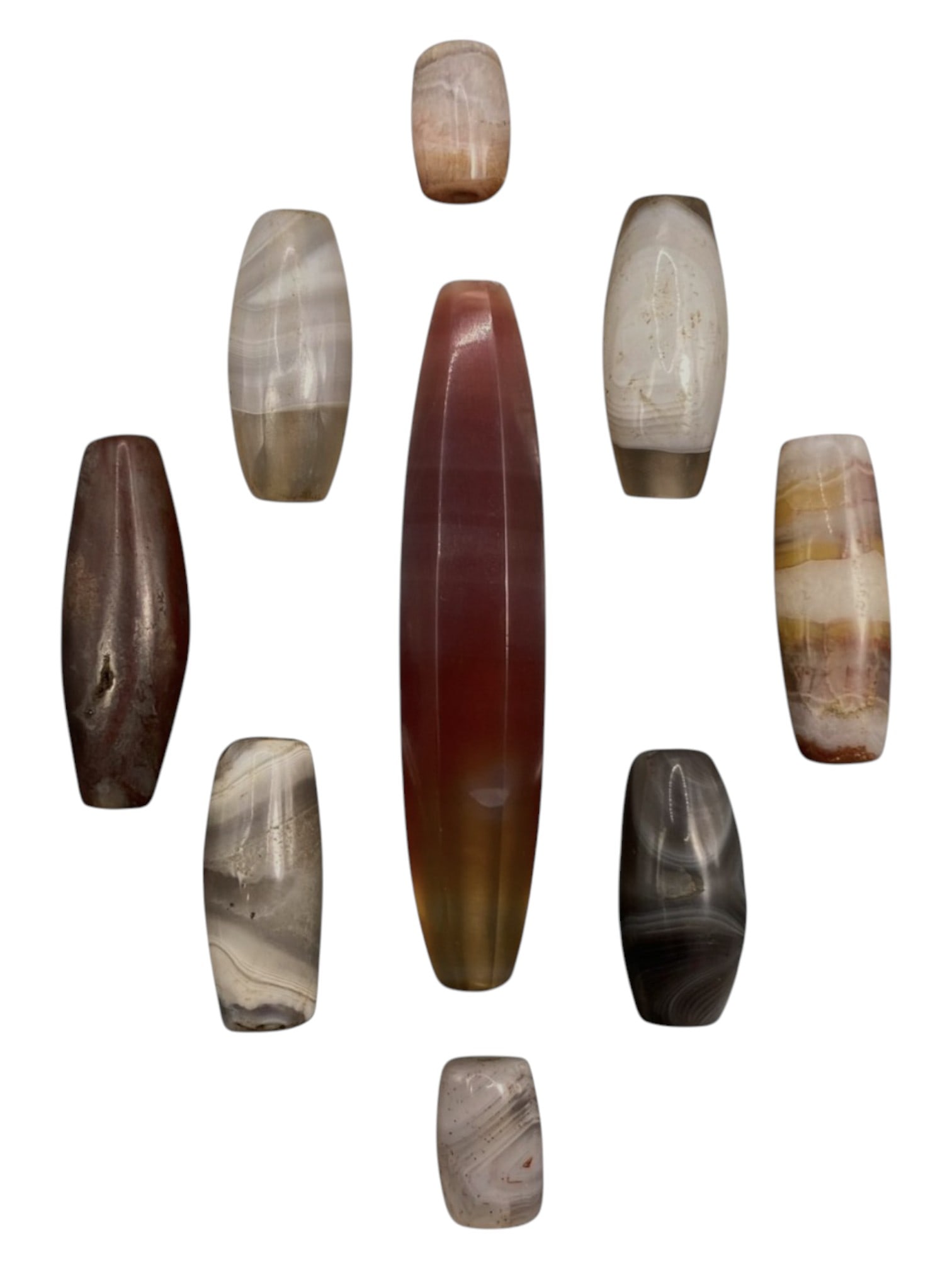 Lot of 9 Himalayan Banded Agate Beads, Ancient to Antique Period, 38WT: A group of nine beads crafted from banded agate, exhibiting natural hues ranging from translucent white, grey, and pale brown to deep red and multi-tonal striations, with characteristic concentric, wa