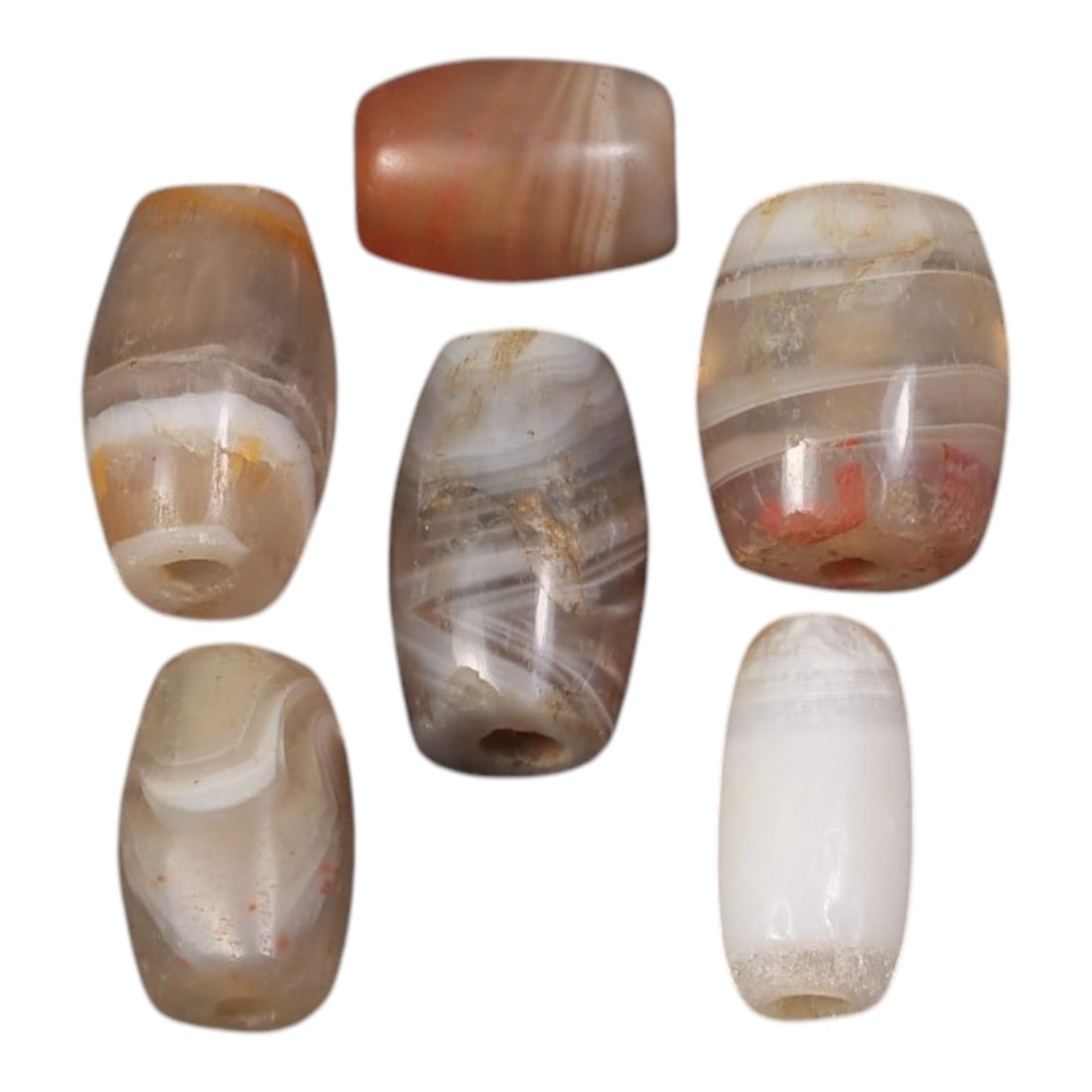 Lot of 6 Ancient to Antique Period Himalayan Silk Road Banded Agate Beads, 63AD: A group of six beads carved from banded agate with natural translucency, varying shades of grey, brown, reddish, and white inclusions, and surface patina consistent with ancient use. The forms are pre