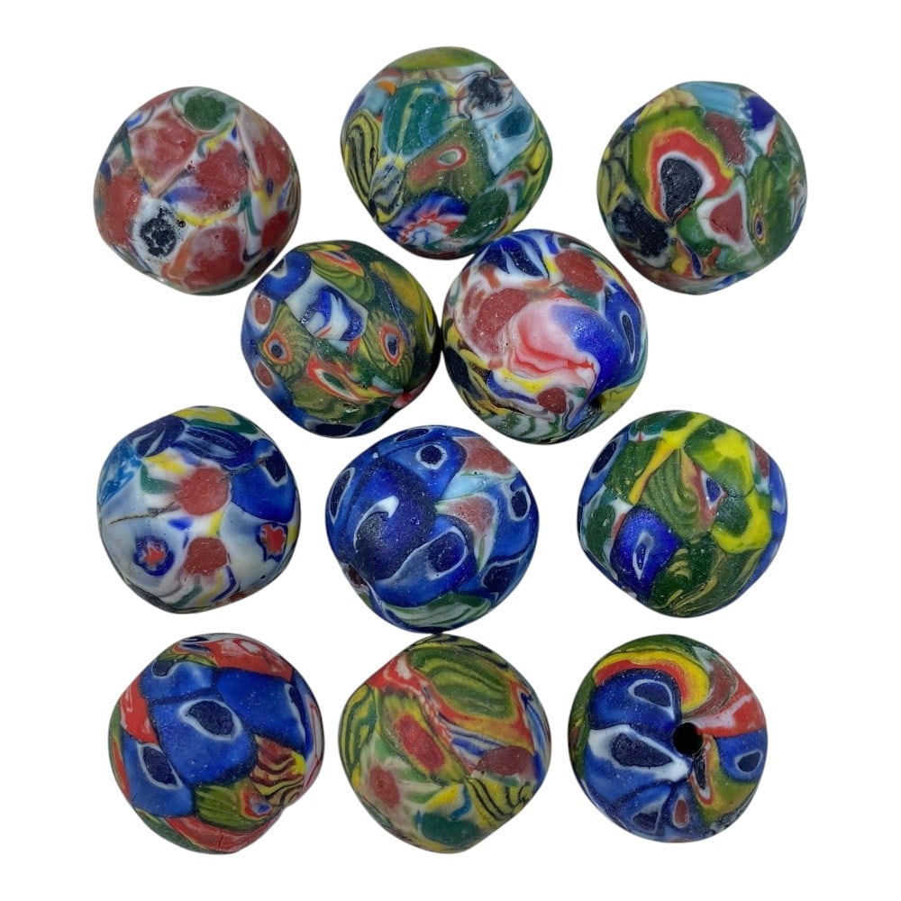 A Lot of 11 Vintage Mosaic Glass Beads, 79AA: The group comprises eleven spherical beads formed from polychrome mosaic glass. Each bead displays intricate patterns of fused millefiori segments in vibrant combinations of blue, green, red, yellow, 