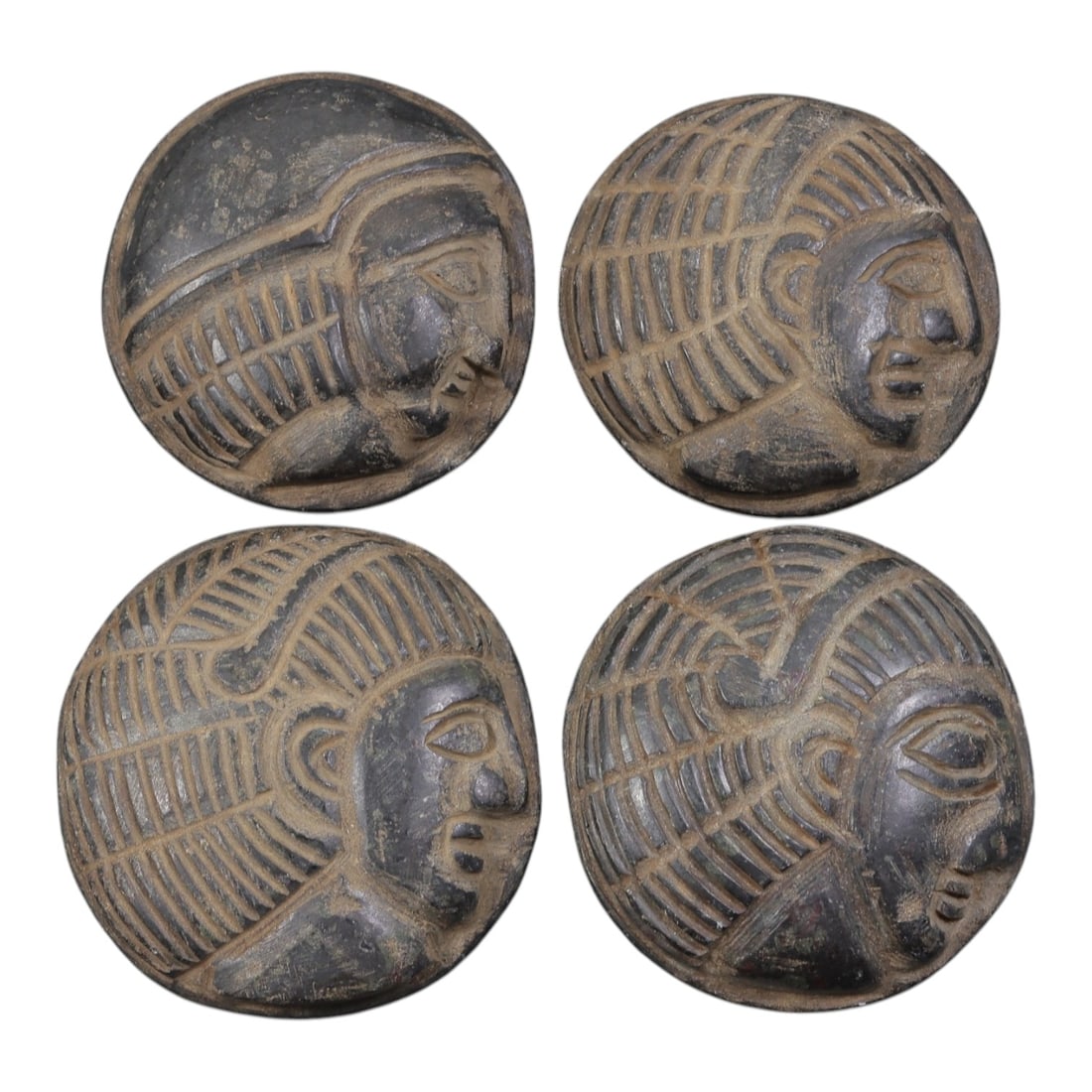 Lot of 4 Ancient Coptic Egyptian Stone Face Beads / Amulets, Circa Roman to Coptic Era, 21AE: Comprising four finely carved dark stone face amulets ranging from 3.5 cm to 4 cm, these pieces are characteristic decorative and protective jewelry from the Coptic Egyptian period. Each bead is rende