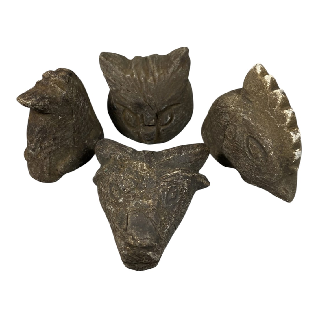 Lot of 4 Medieval Mediterranean Zoomorphic Stone Carvings, 74AG: A collection of four hand-carved stone zoomorphic heads, attributed to medieval folk or tribal art traditions of the Mediterranean region. Crafted from weathered dark stone with deep patination, surfa
