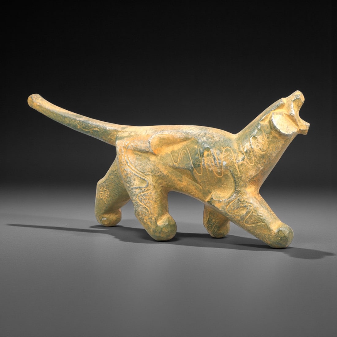 A Stylized Bronze Zoomorphic Figure, 20th Century, 50FK: Cast in bronze and modeled as a stylized quadruped animal, the figure is shown in a striding pose with elongated body, extended tail, and angular legs supporting a forward-leaning stance. The head is 