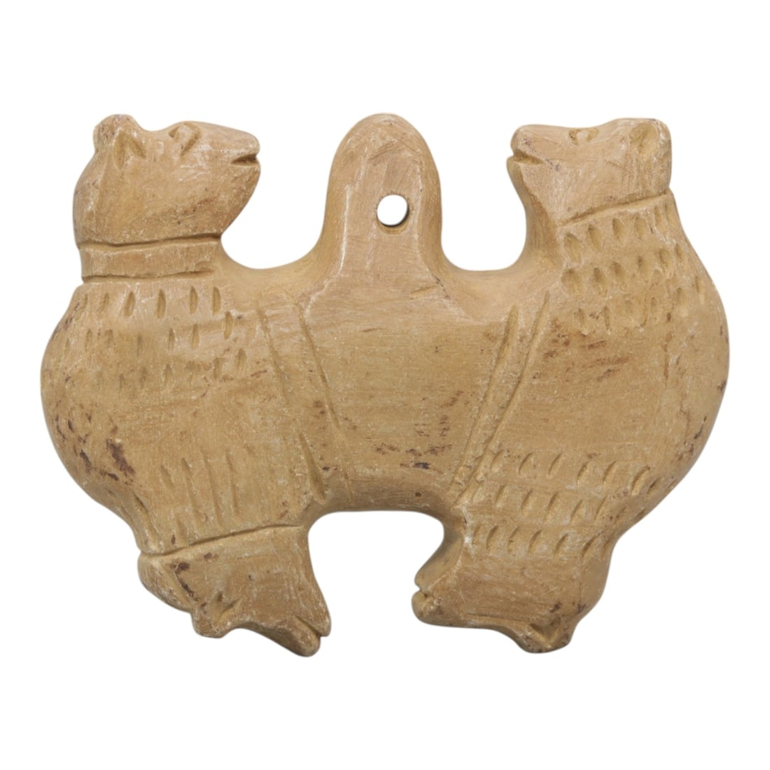 Ancient Stone Double Zoomorphic Amulet - Near Eastern, 17WJ: Carved from a fine-grained, pale beige stone, this artifact takes the form of a symmetrical double zoomorphic amulet, depicting two confronting animal figures joined at a central suspension loop. Each