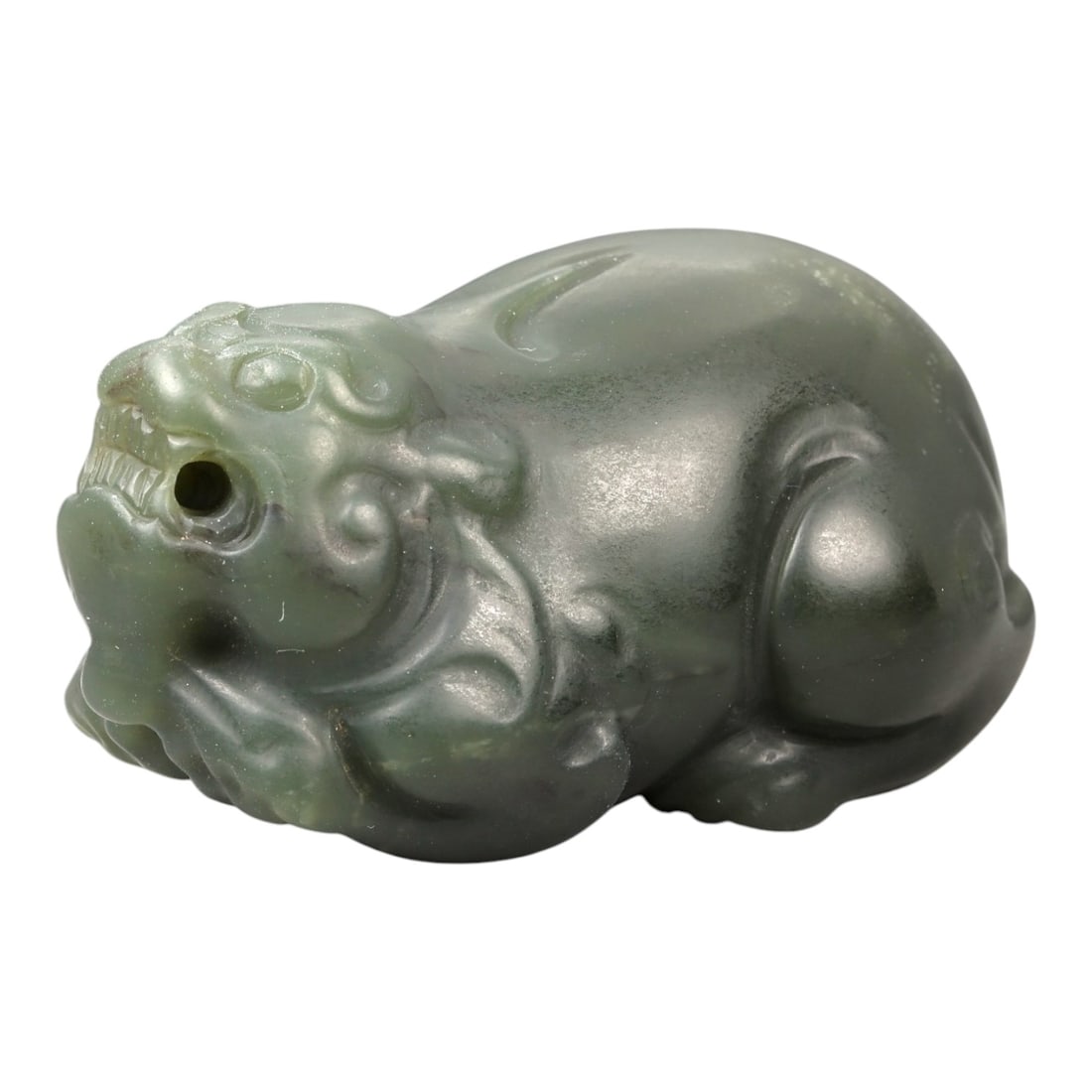 Chinese Jade Pixiu Beast - Carved Animal Figurine 5.2cm, 99ZC: Carved from pale green jade with soft translucency and subtle natural mottling, this sculptural figure represents a pixiu rendered in a compact recumbent posture. The carving is worked fully in the ro