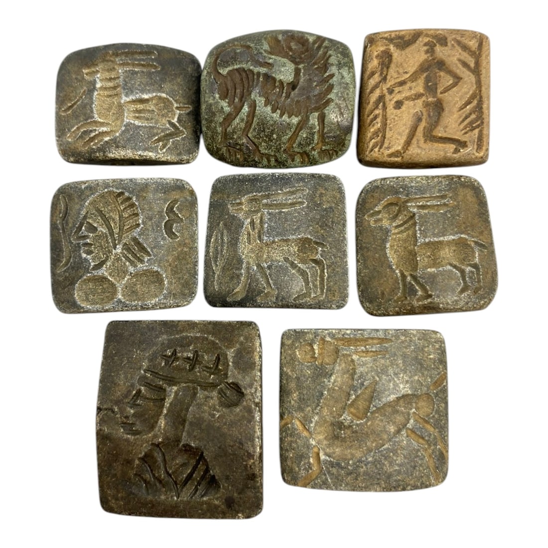 Lot of 8 Ancient Near Eastern Double Convex Stamp Seal Beads, 10WK: A collection of eight ancient Near Eastern stamp seal beads, each carved in the characteristic double-convex form common in the region's bead and seal traditions. Crafted from natural stone in varying