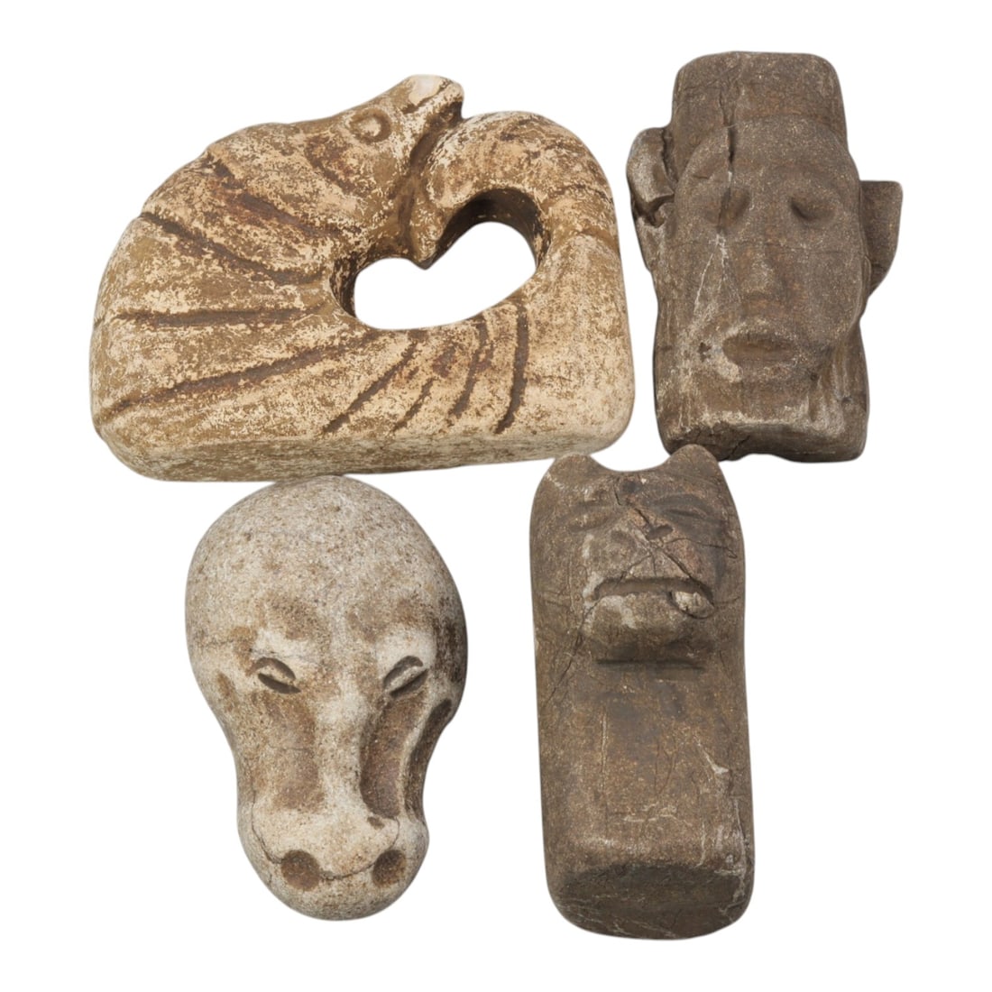 Lot of 4 Medieval Tribal Stone Carvings, 22WT: A set of four hand-carved stone objects, measuring approximately 4-6 cm in height, showcasing medieval tribal stonework. The pieces include a stylized animal-form carving with a heart-shaped opening, 
