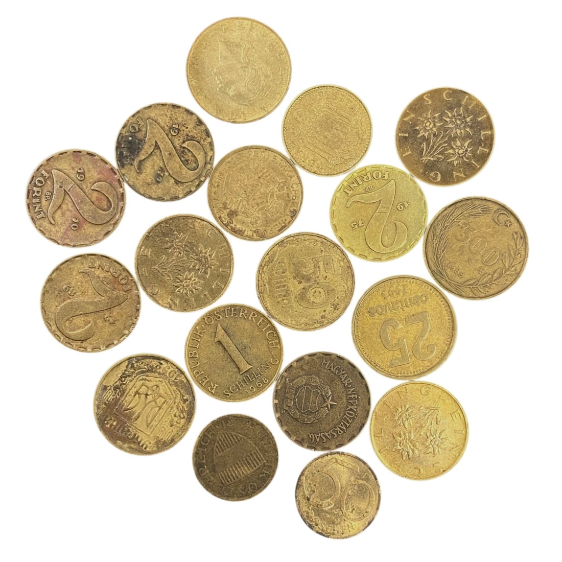EUROPEAN CURRENCIES: Post-War Transition - Mixed Brass Coin Bulk Lot, 15V: This curated lot of European brass coins spans mid-20th century currencies, capturing the diverse monetary identities of Austria, Hungary, and beyond. The collection features Austrian Schillings adorn