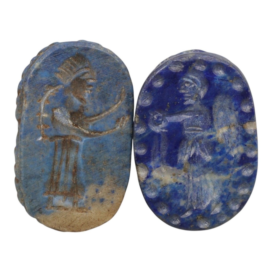Lot of 2 Ancient Coptic Egyptian Lapis Lazuli Scarabs, Circa Roman to Coptic Era, 84WL: Each scarab is carved from lapis lazuli, exhibiting deep blue tones with natural calcite inclusions and surface patination consistent with age. Both are oval in form, with carved figural scenes incise