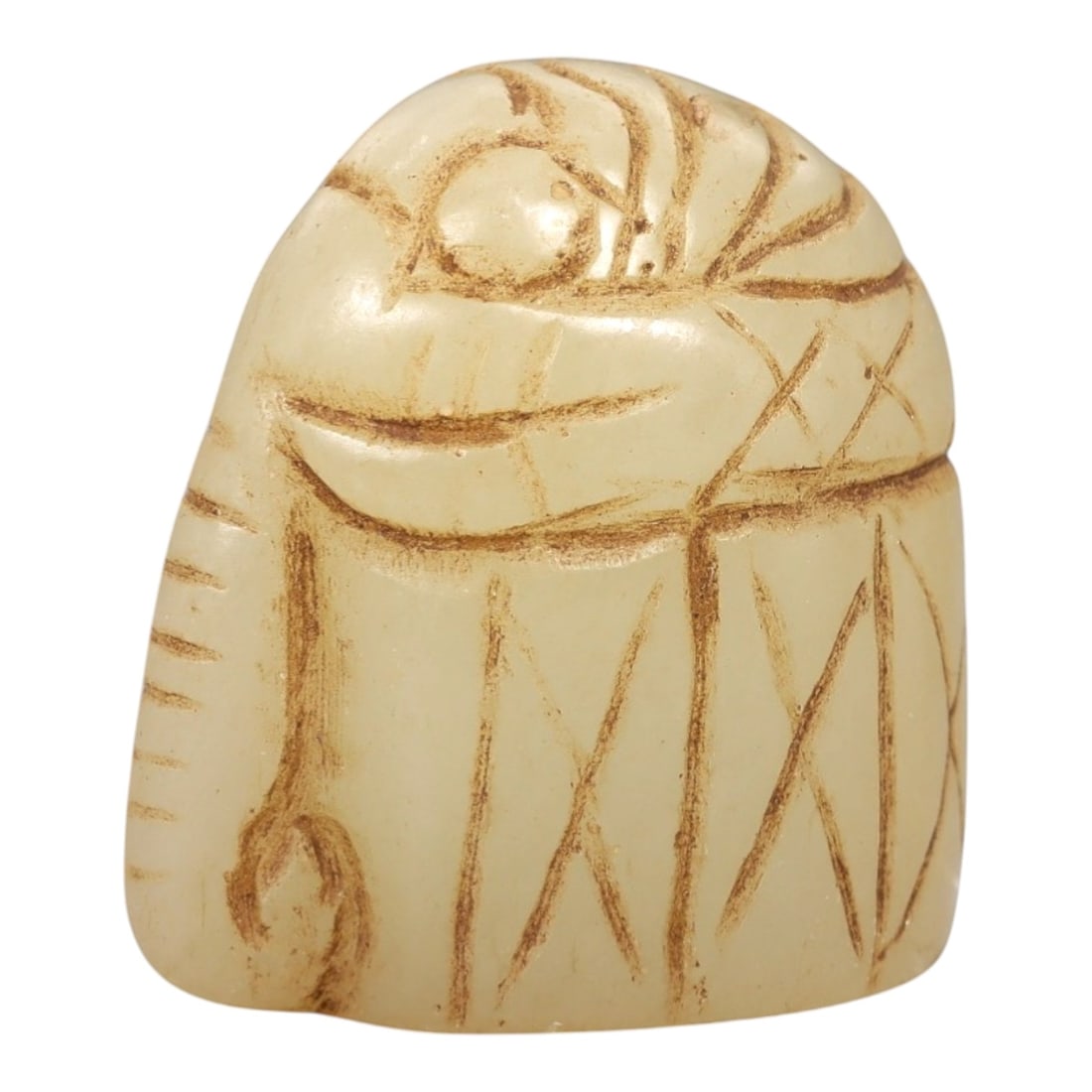Ancient Serpentine Elephant - Near Eastern Figurine, 67AL: This artifact is carved from serpentine, depicting a stylized elephant form with a compact, rounded body and incised decorative motifs including linear and cross-hatch patterns on the surface. The car