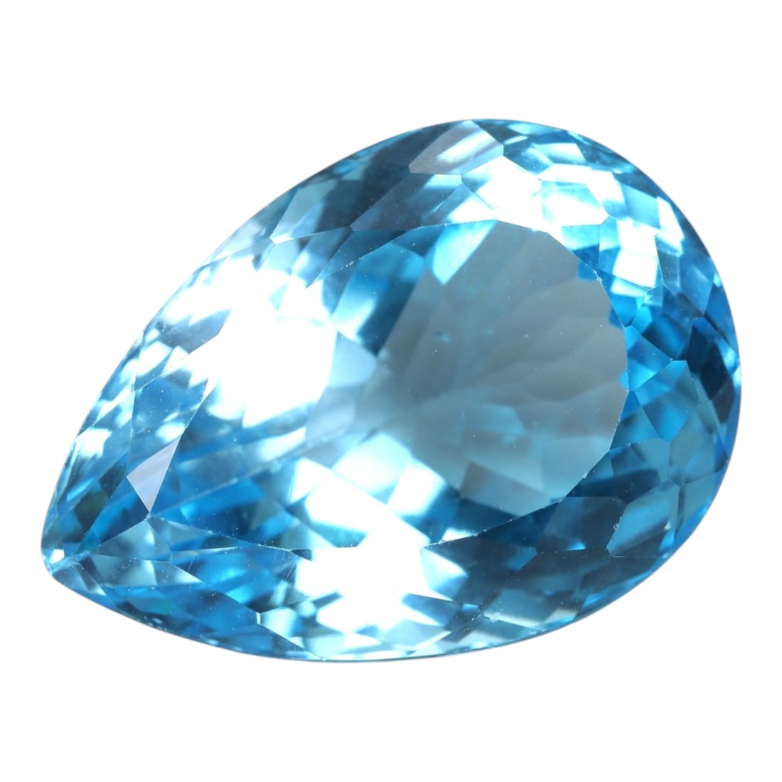 31.44 Carats Swiss Blue Topaz Pear - Natural Brazilian Stone, LZ104: This magnificent pear-cut Swiss blue topaz radiates with a vibrant, icy blue hue that evokes the clarity of alpine lakes and glacial skies. The gem is masterfully faceted, with precisely angled surfac