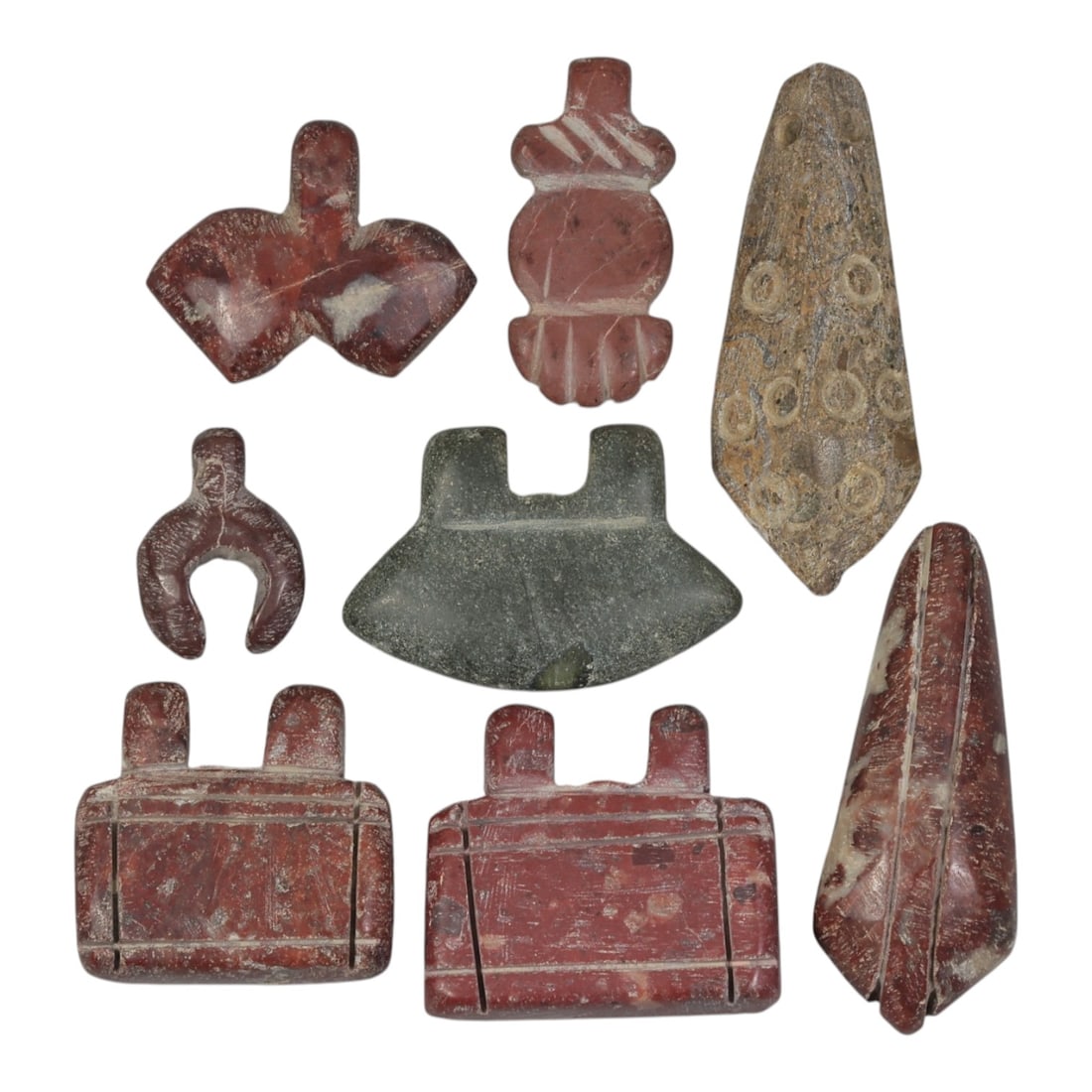Lot of 8 Ancient Coptic Egyptian Multi-Stone Amulets, Circa Roman to Coptic Era, 89AH: Carved from various earth-toned stones including reddish-brown, green serpentine, and speckled varieties, the group consists of eight distinct amulets, ranging in size from 2 cm to 4 cm (0.79-1.57 in.