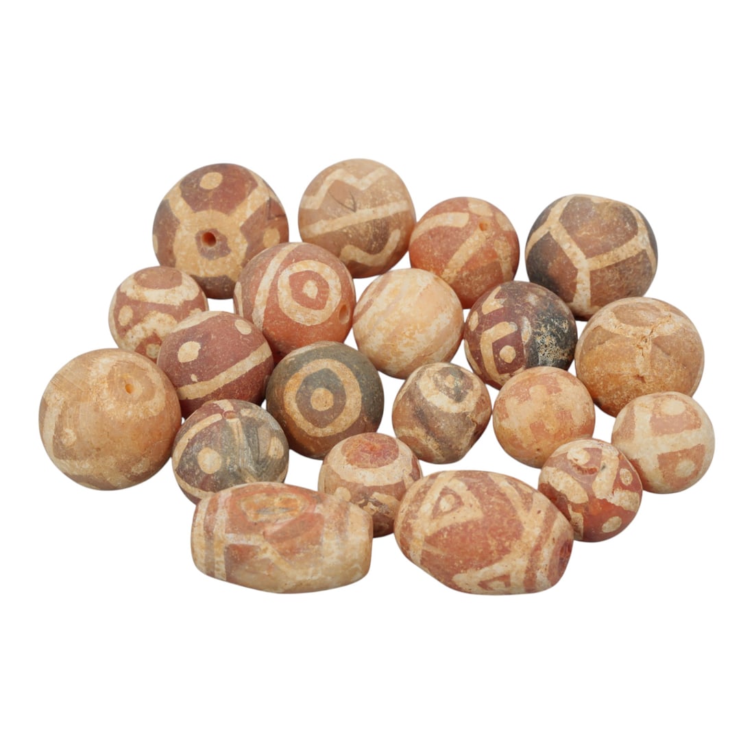 Lot of 20 Ancient Etched Carnelian Beads, Gandhara Period, 20WM: A group of 20 ancient etched carnelian beads from the Gandhara period. The beads feature spherical and barrel forms, crafted from reddish-orange, light beige, and greyish carnelian. Each bead displays