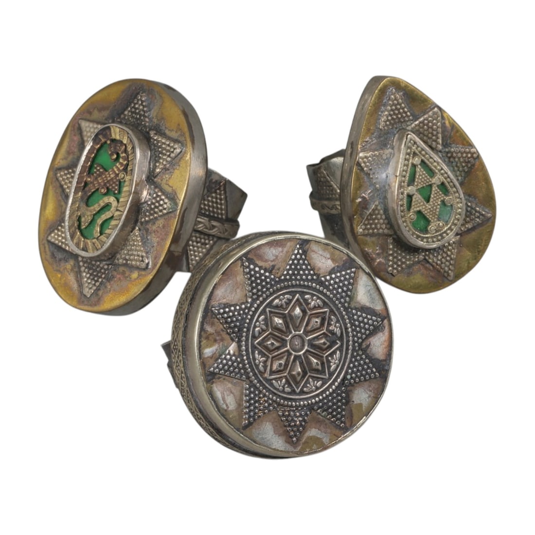Lot of 3 Vintage North African (Berber / Tuareg) Silver-Plated Gilt Statement Rings, 57AH: A set of three vintage statement rings, crafted in silver-plated metal with gilt accents, featuring traditional North African Berber or Tuareg-inspired designs. The rings display signature motifs of t
