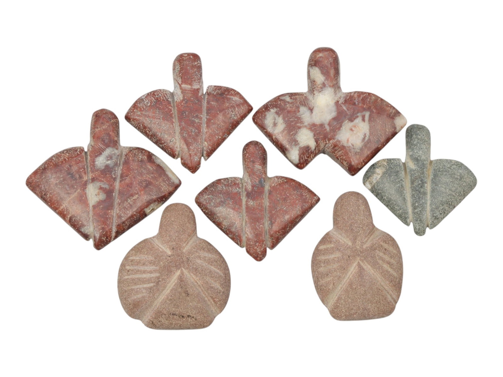 Lot of 7 Ancient Coptic Egyptian Multi-Stone Fly Amulets, Circa Roman to Coptic Era, 66WT: Carved from red marble, grey stone, and pinkish sandstone, the group consists of seven distinct fly-shaped amulets, ranging in size from 2.5 cm to 3 cm (0.98-1.18 in.). The set features stylized fly f
