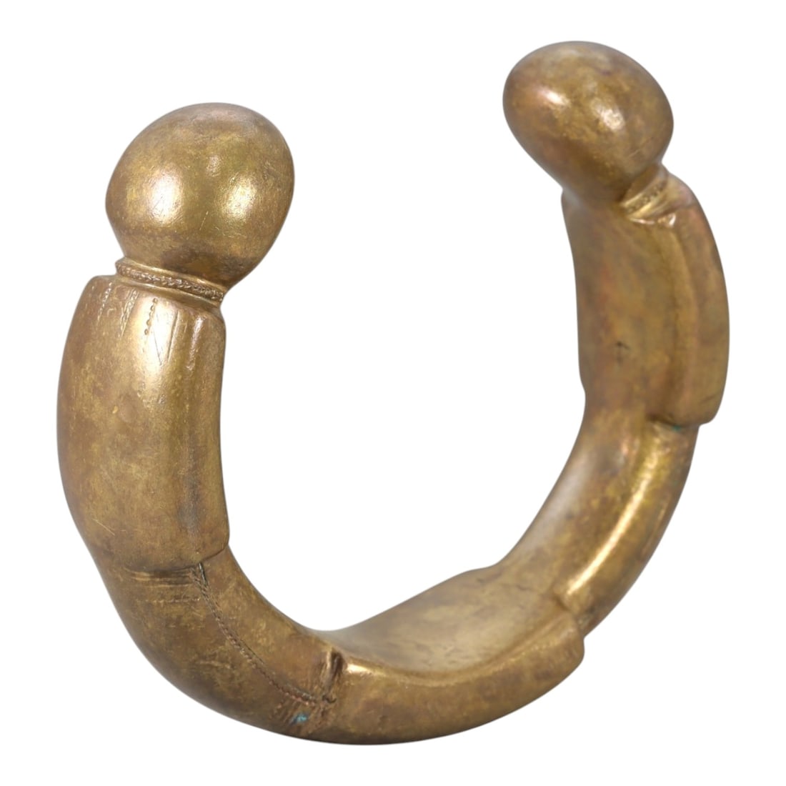 African Bronze Queen Manilla - West African Bracelet Currency, 95FW: Cast from golden-brown bronze, this 6.5cm diameter manilla (bracelet currency) features a robust C-shaped form with two bulbous terminal ends, each adorned with subtle incised linear details and decor