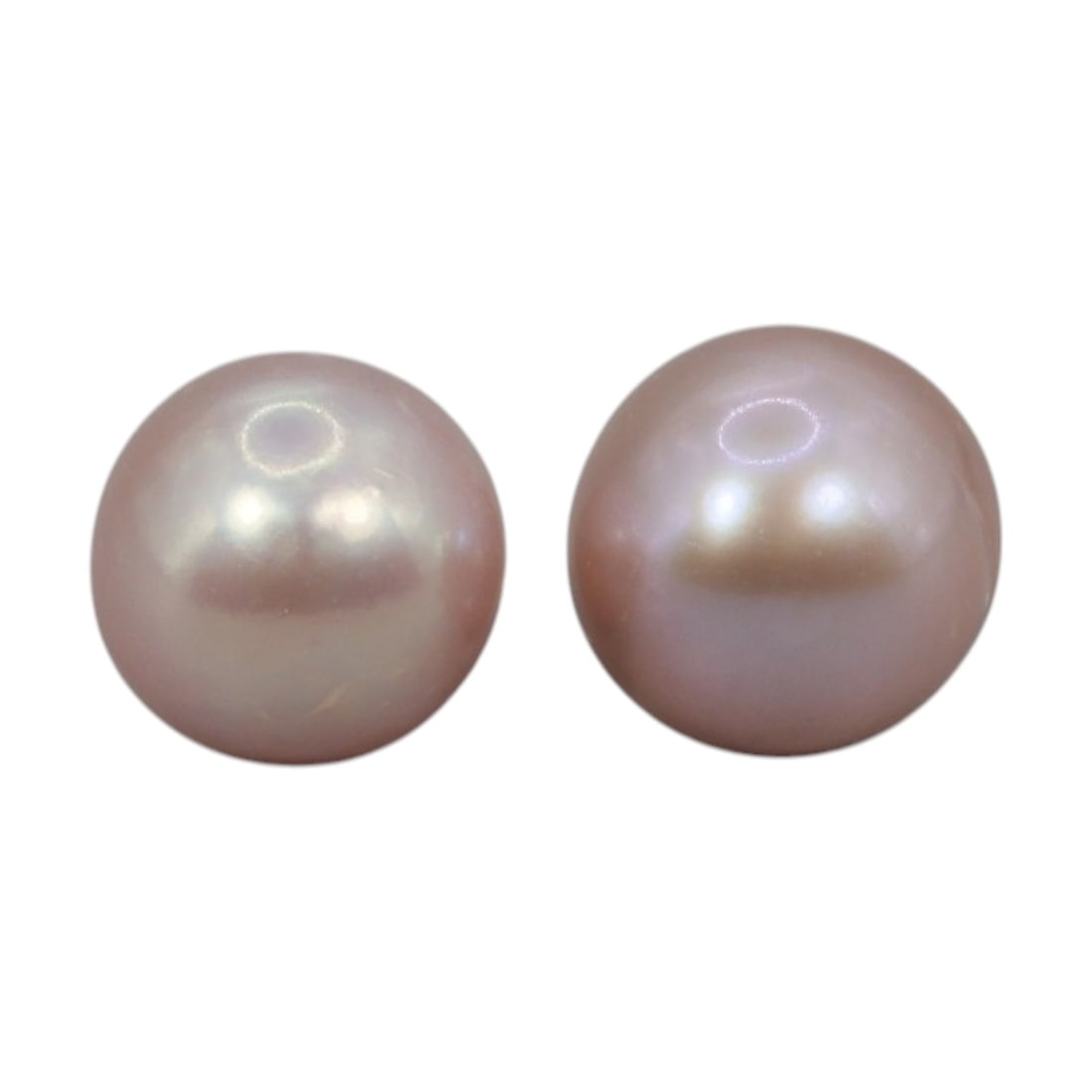 Freshwater Pearl Pair - Natural Pearl Pink Round Gemstones 7.3mm, 17XA: A matched pair of natural freshwater pearls, exhibiting a soft pinkish-peach hue with bright, even luster and subtle iridescent orient. The pearls are near-spherical, with smooth nacre and minor natur