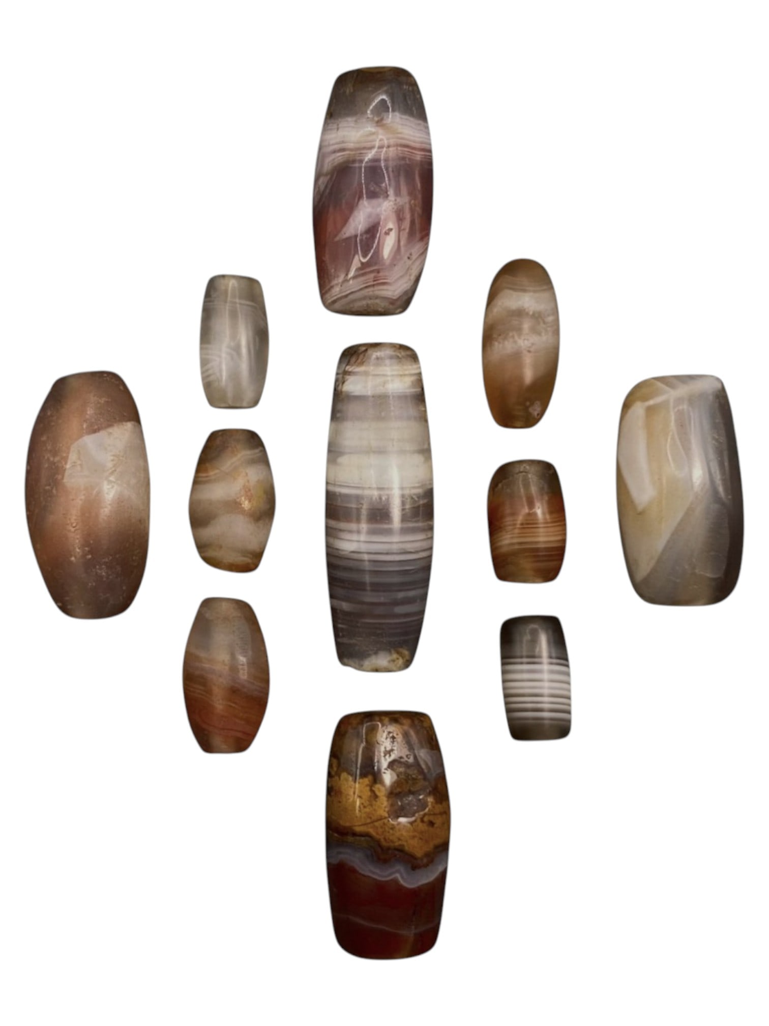 Lot of 11 Himalayan Banded Agate Beads, Ancient to Antique Period, 32WT: A group of eleven beads crafted from banded agate, showcasing natural hues including translucent grey, milky white, smoky brown, and reddish-amber tones, with characteristic concentric, wavy, and line