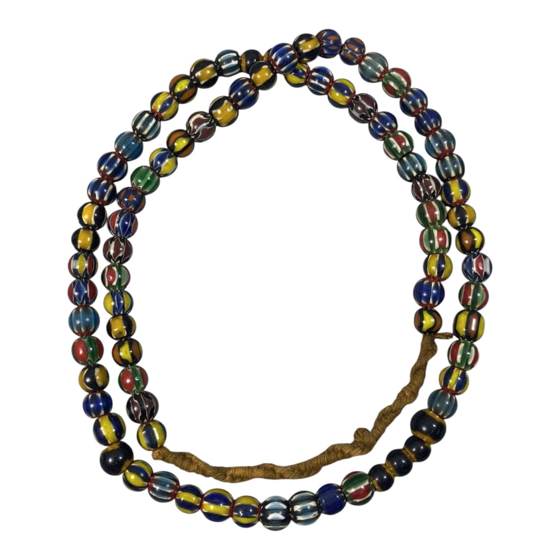 Strand of Antique Chevron Glass Beads, Unstrung, 64AH: A single strand of unstrung antique chevron glass beads, measuring approximately 30 cm in length. The strand features round beads adorned with vibrant, multicolored striped chevron patterns, character