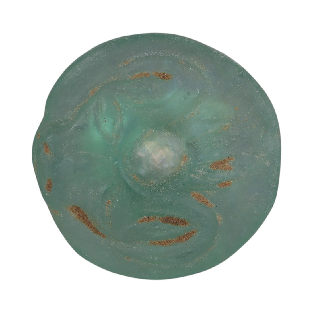 An Ancient Roman Glass Amulet Pendant, 67AH: A single ancient-style glass amulet pendant, crafted from translucent turquoise Roman glass, measuring approximately 4.5 cm in diameter. The pendant features a stylized zoomorphic motif, likely depict