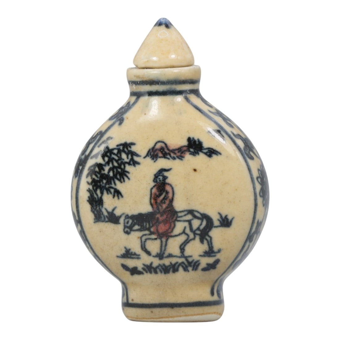 A Chinese Porcelain Snuff Bottle, 20th Century, 7YD: Crafted from porcelain with a pale cream glaze and decorated in underglaze blue with copper red accents, the snuff bottle features a flattened, rounded body, a short cylindrical neck, and a conical st