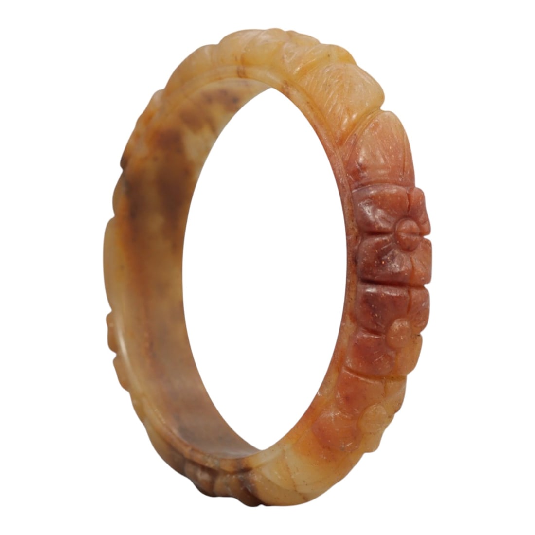 A Chinese Carved Jadeite Jade Bangle Bracelet, 20th Century, 43ZL: A fine jadeite bangle of flattened circular form, masterfully carved in relief with a continuous band of floral blossoms and scrolling foliate motifs. The stone exhibits a striking variegated palette,