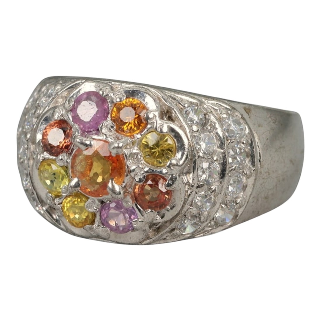 Multicolor Fancy Sapphire and White Stone Ring - Size 7 US - 25 x 21 mm - 6.6 Grams, 47XK: This vibrant cocktail ring bursts with a kaleidoscope of fancy sapphires in shades of golden yellow, vivid orange, pastel pink, and warm cinnamon, all prong-set in a central floral cluster. Surroundin