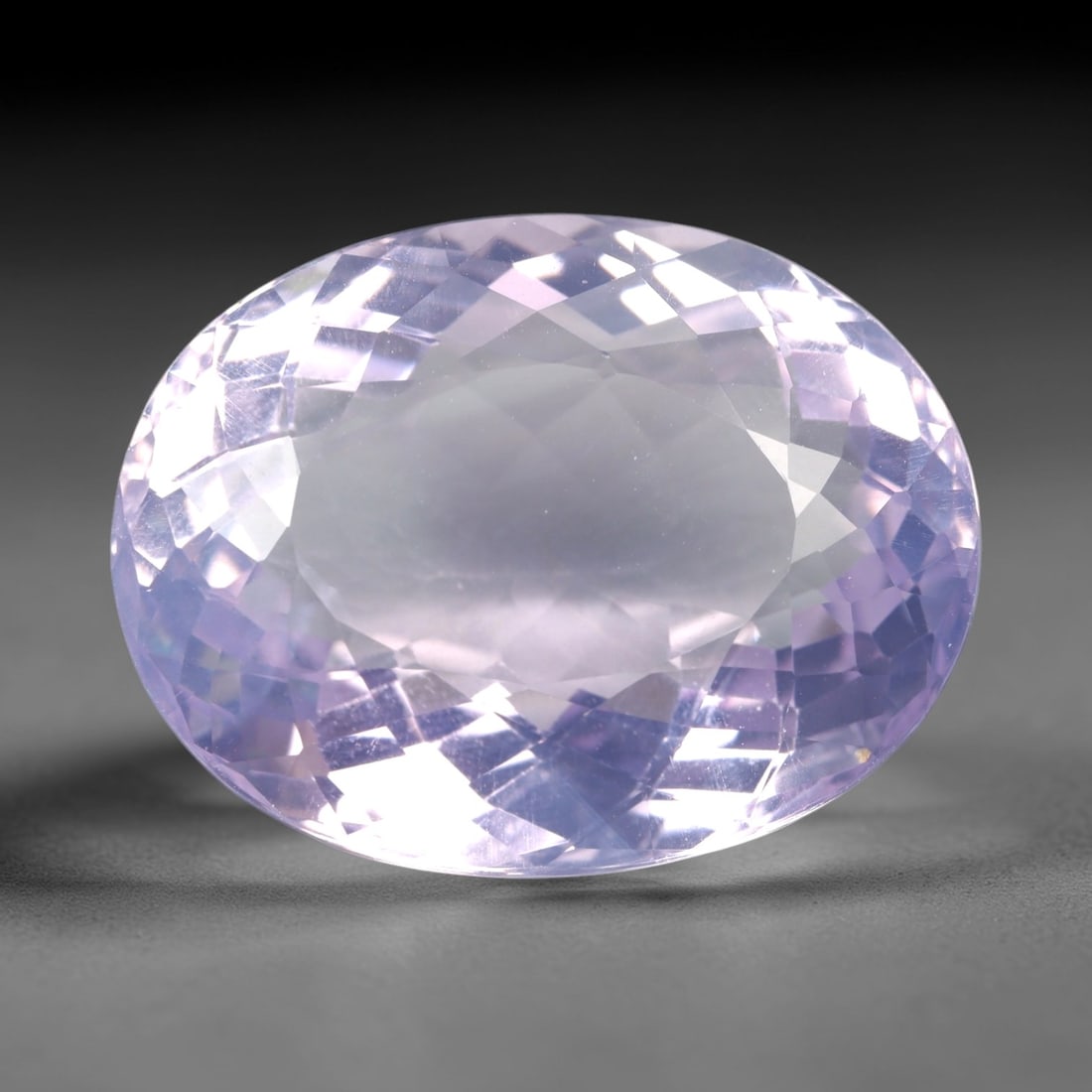 34.13 Carats Lavender Amethyst Oval - Natural Loose Gemstone, LZ63: This magnificent 34.13 carat lavender amethyst is precision-cut into a classic oval shape, measuring 24.8mm x 19.2mm x 11.7mm. It glows with a soft, ethereal lavender hue, reminiscent of a misty twili