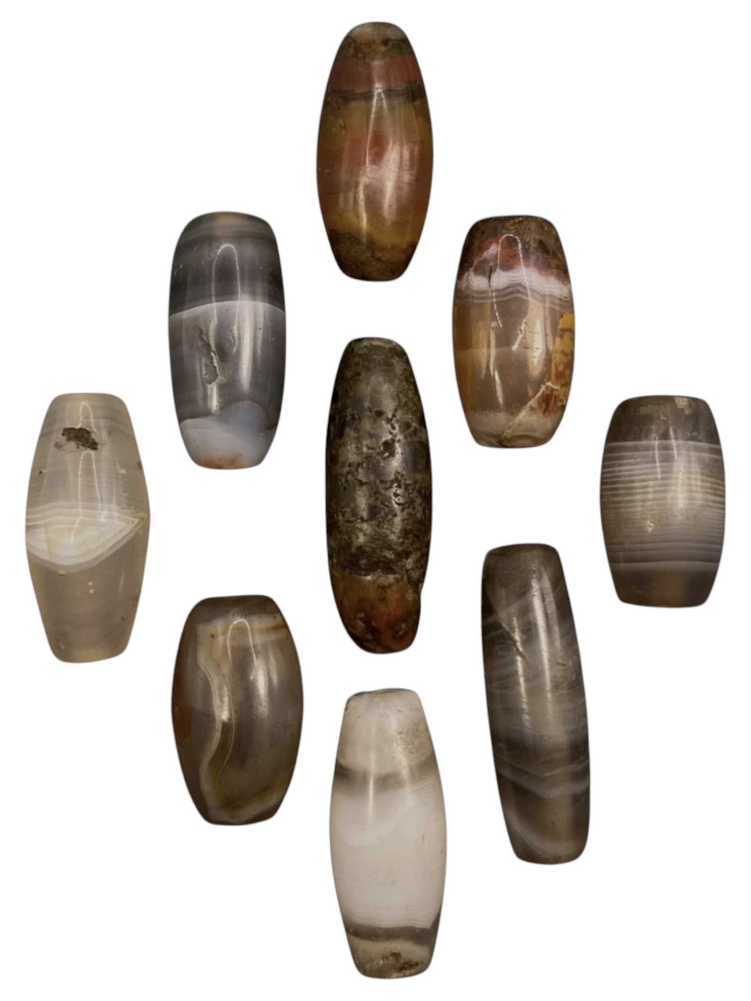 Lot of 9 Himalayan Banded Agate Beads, Ancient to Antique Period, 31WT: A group of nine beads crafted from banded agate, exhibiting a rich spectrum of natural hues including translucent grey, smoky brown, milky white, and reddish-brown tones, with characteristic concentri
