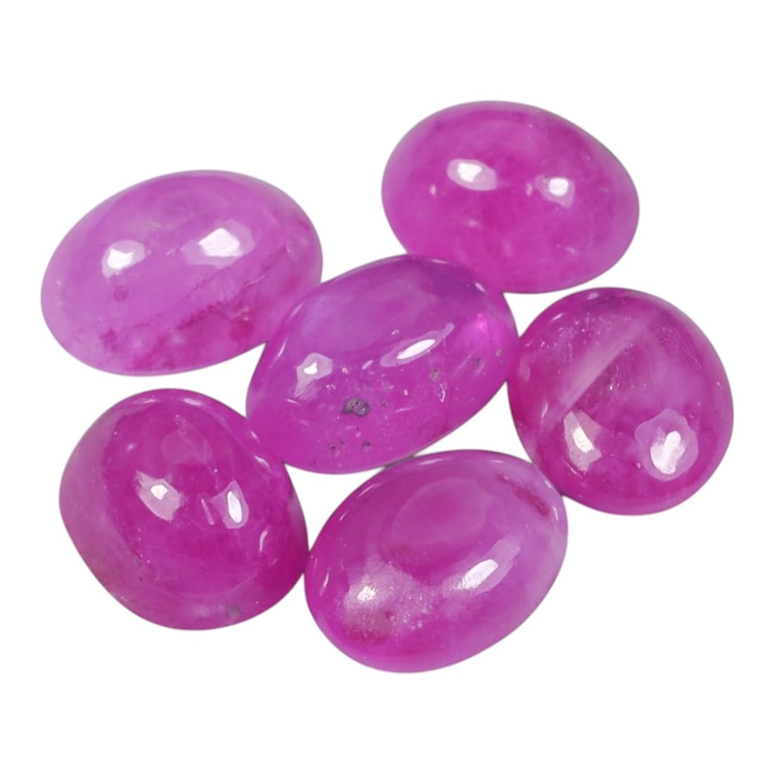 5.42 Carats Natural Ruby - Oval Cabochon Gemstone, 97WE: Oval cabochon-cut ruby gemstone, crafted from natural ruby material. The stone exhibits a vivid, saturated pinkish-magenta hue, with subtle natural inclusions, internal veining, and minor surface text