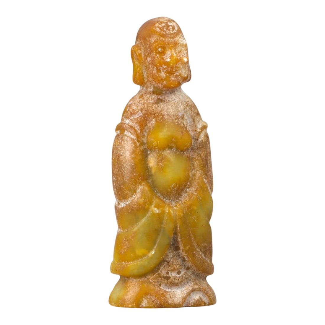 A Chinese Stone Figure of a Standing Attendant or Immortal, 20th Century, 96YA: Carved as a standing male figure, this small sculpture is worked from a warm-toned stone with mottled honey, ochre, and pale yellow inclusions, the surface showing natural translucency and areas of gr