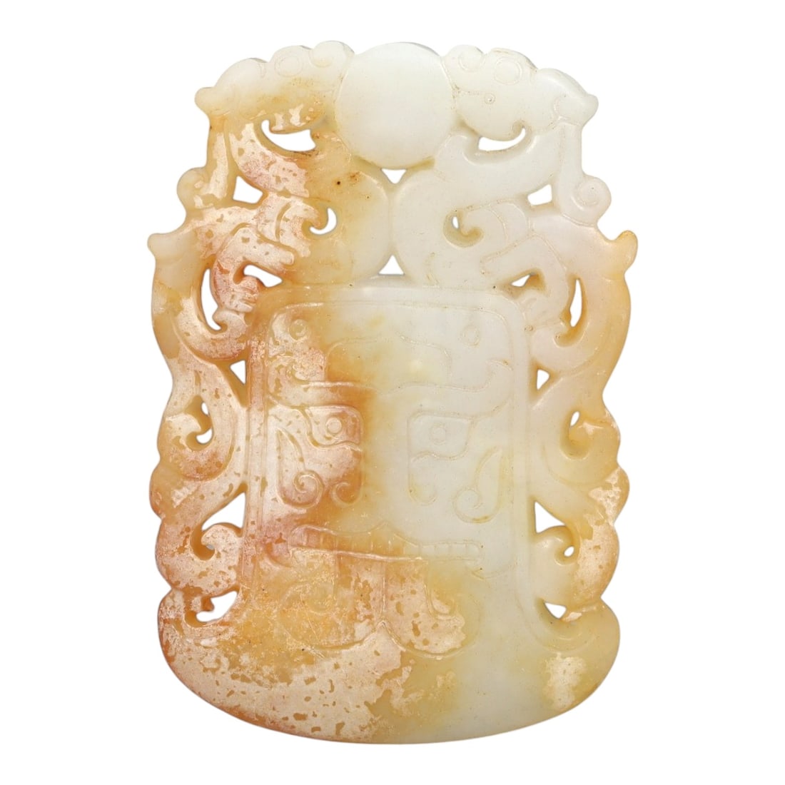 A Chinese Archaistic-Style Jade Openwork Plaque, 20th Century, 53FH: Carved from pale celadon-white jade with areas of warm russet staining and natural inclusions, the plaque is vertically oriented and executed in openwork and shallow relief. The upper section is forme
