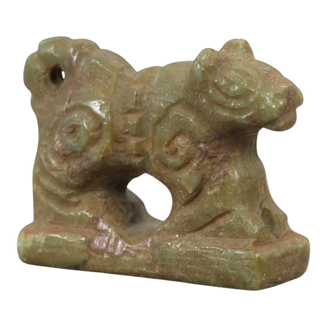 Ancient Serpentine Amulet - Near Eastern Animal Figure, 61AL: This artifact is carved from serpentine, depicting a stylized animal form, likely a feline or feline-like creature, standing on a rectangular integral base. The carving features incised decorative mot