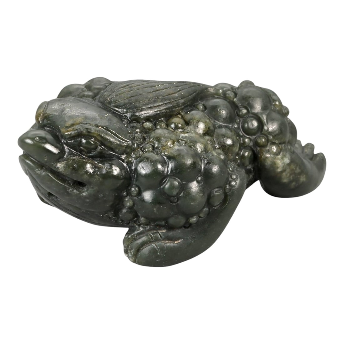 A Chinese Nephrite Jade Frog Carving, 20th Century, 25FB: Carved from dark green nephrite jade with lighter mottling and natural inclusions, the sculpture is worked in the round in the form of a crouching frog. The body is compact and low to the ground, with
