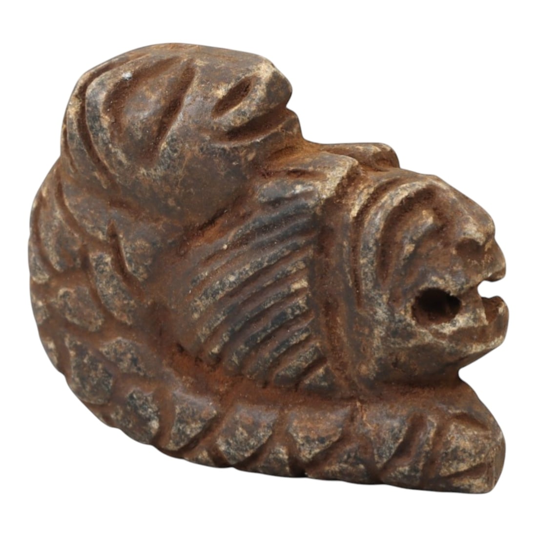 Ancient Steatite Lion - Near Eastern Amulet Figurine, 97AK: Carved from steatite, this amulet depicts a recumbent lion with incised linear details defining the mane, facial features, and body, including a suspension hole in the muzzle for wearable use. Attribu