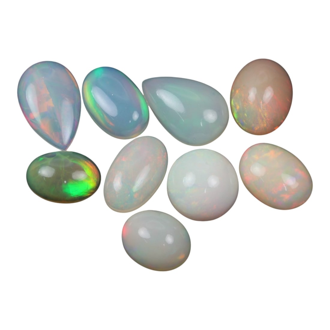 24.95 Carats Pastel Play-of-Color Welo Opal Lot - Natural Ethiopian Stones - 11 to 14 mm, 49XK: This luminous collection of Welo opals delights with soft body tones and a full-spectrum play-of-color. Ranging from translucent white to milky blue, each cabochon displays inner flashes of neon green