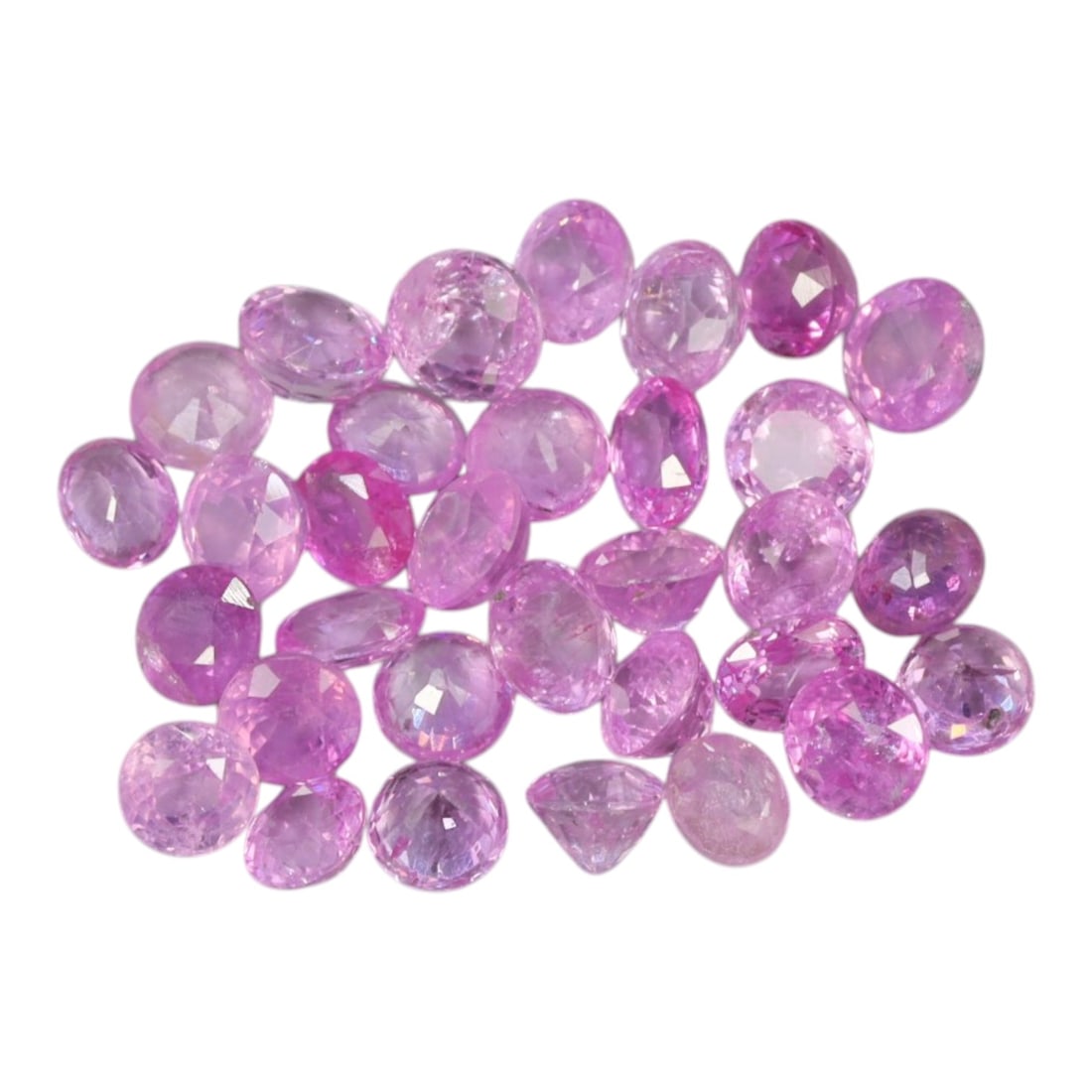 5.02 Carats Pastel Pink Sapphire Parcel - Natural Ceylon Stones, 77XC: This luminous parcel of round and oval-cut pink sapphires glows with soft, pastel pink hues, ranging from delicate rose to vibrant bubblegum tones. Each stone is faceted to enhance its natural brillia