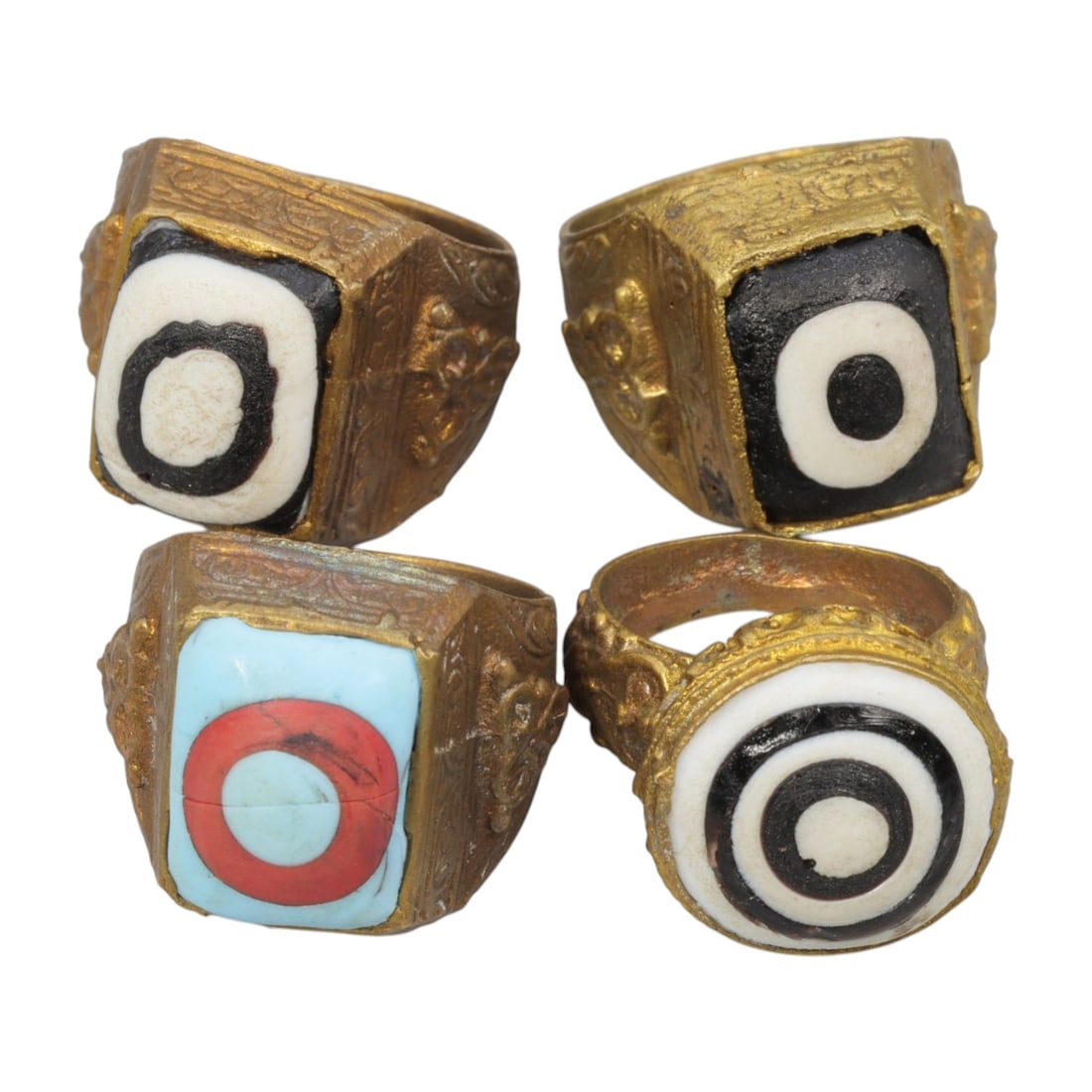 Lot of 4 Antique Qajar Period Gilt Evil Eye Glass Rings, 3AD: A collection of four antique gilt-metal rings from the Qajar period (19th century), each set with colorful "evil eye" glass cabochons. The set features varied designs: three rings with black-and-white