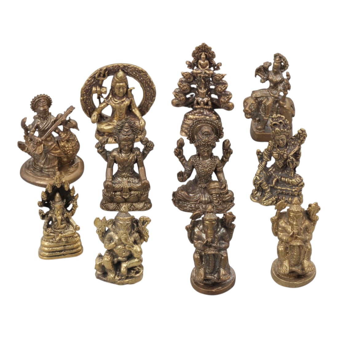 A Lot of 11 Vintage Southeast Asian Brass and Bronze Figurines, 4WT: A curated lot of eleven vintage Southeast Asian devotional figurines, crafted from brass and bronze. The collection features depictions of Hindu deities including Ganesha, Shiva, Lakshmi, Saraswati, a