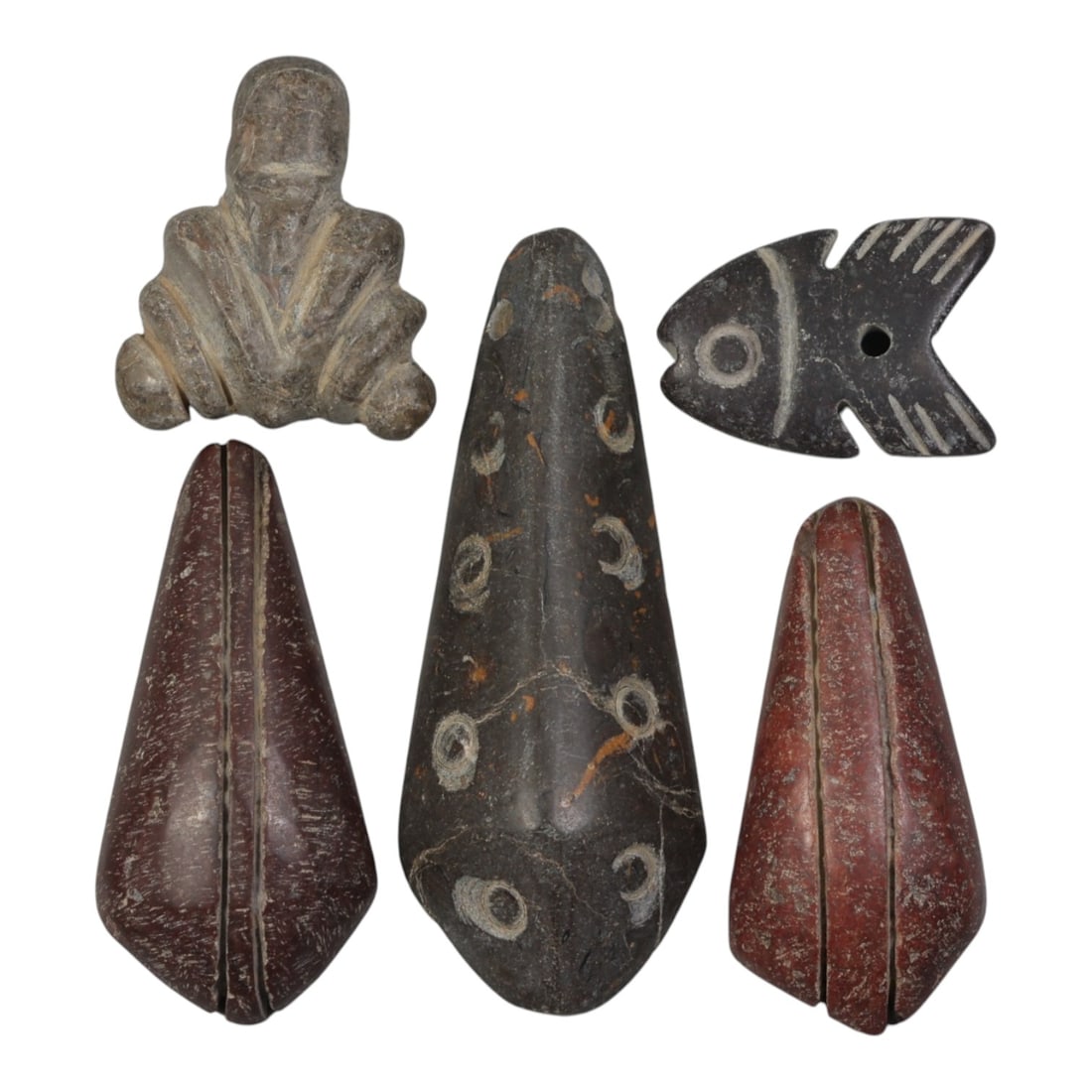Lot of 5 Ancient Coptic Egyptian Stone Amulets, Circa Roman to Coptic Era, 80WT: Carved from various stones, including greyish-brown, reddish-brown, and dark brown varieties, the group consists of five distinct amulets. The set includes a stylized seated figure pendant, three coni