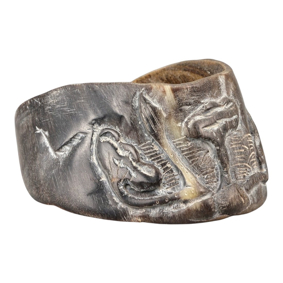 A Chinese Horseshoe Hoof (Ma Ti) Carved Brush Washer, 20th Century, 18YB: Carved from a natural horseshoe hoof (ma ti), the object is worked into a shallow, irregularly oval vessel with thick walls and an uneven rim, following the original organic form of the material. The 