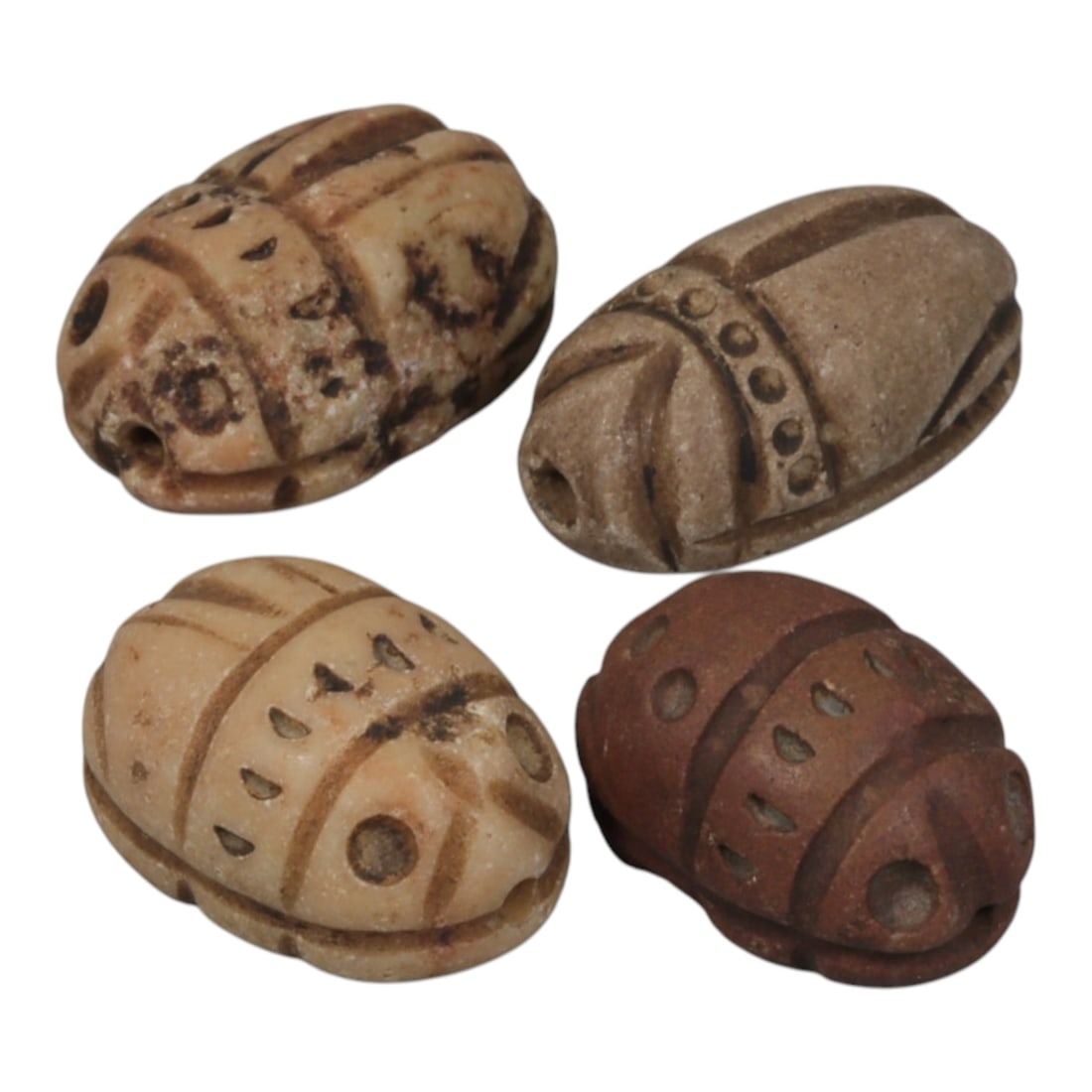 Lot of 4 Ancient Coptic Egyptian Stone Scarabs, Circa Roman to Coptic Era, 94WT: Carved from various earth-toned stones in beige, light brown, and reddish-brown hues, the group consists of four distinct scarab amulets. Each piece features the characteristic scarab form with incise